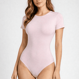 Muted pink eco natural bodysuit made from 94% Lenzing Tencel Lyocell fabric